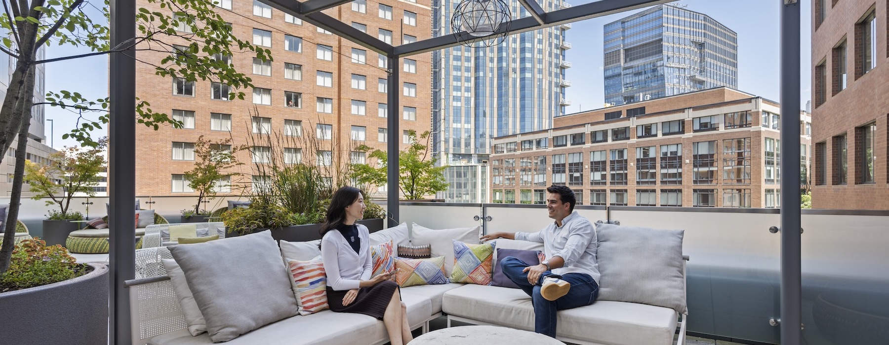 a couple sitting under a cabana